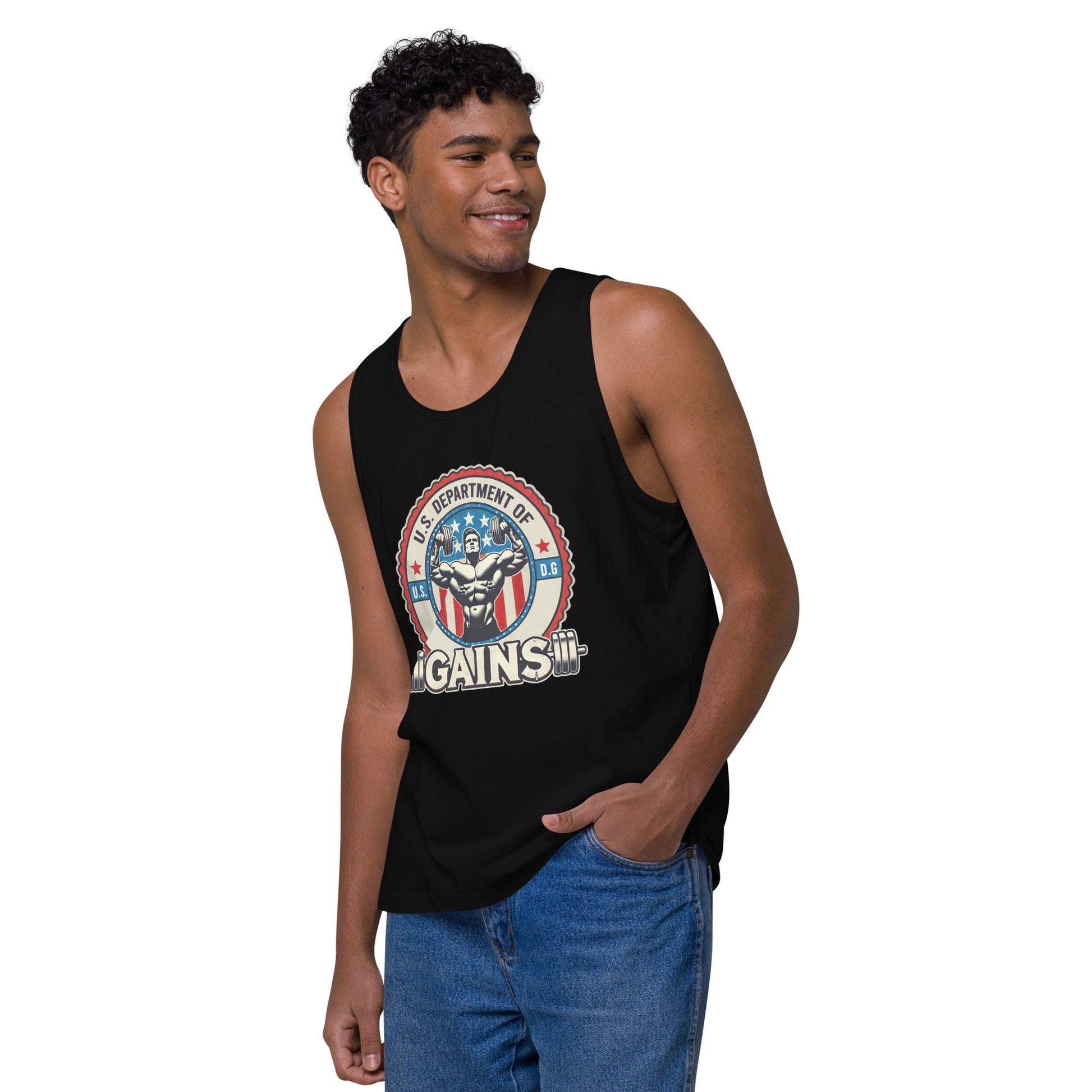 A person confidently poses in a U.S. Department of Gains tank top by Bougie Boiz Club, featuring weights and an emblem. With short curly hair and blue jeans, they stand against a plain white background. The attire showcases their gym hero style.