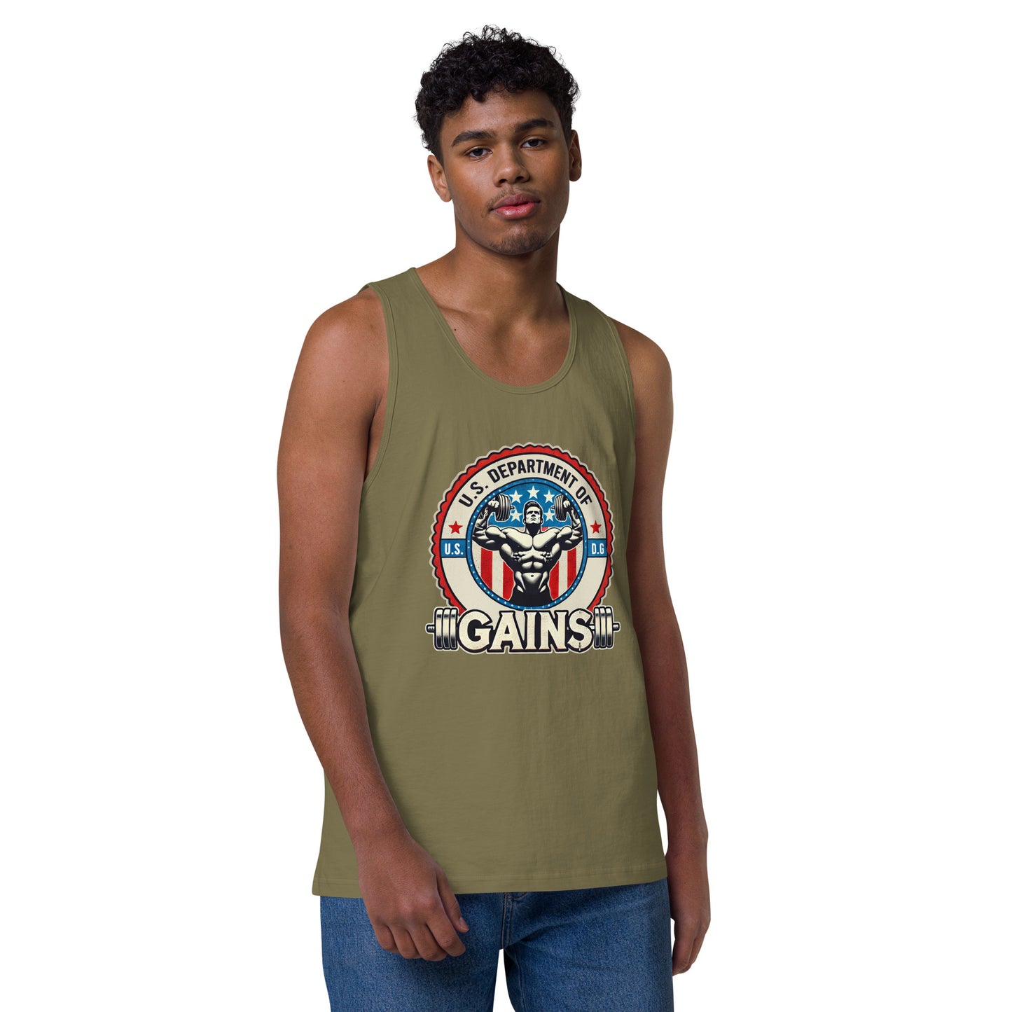 A person confidently poses in a U.S. Department of Gains tank top by Bougie Boiz Club, featuring weights and an emblem. With short curly hair and blue jeans, they stand against a plain white background. The attire showcases their gym hero style.