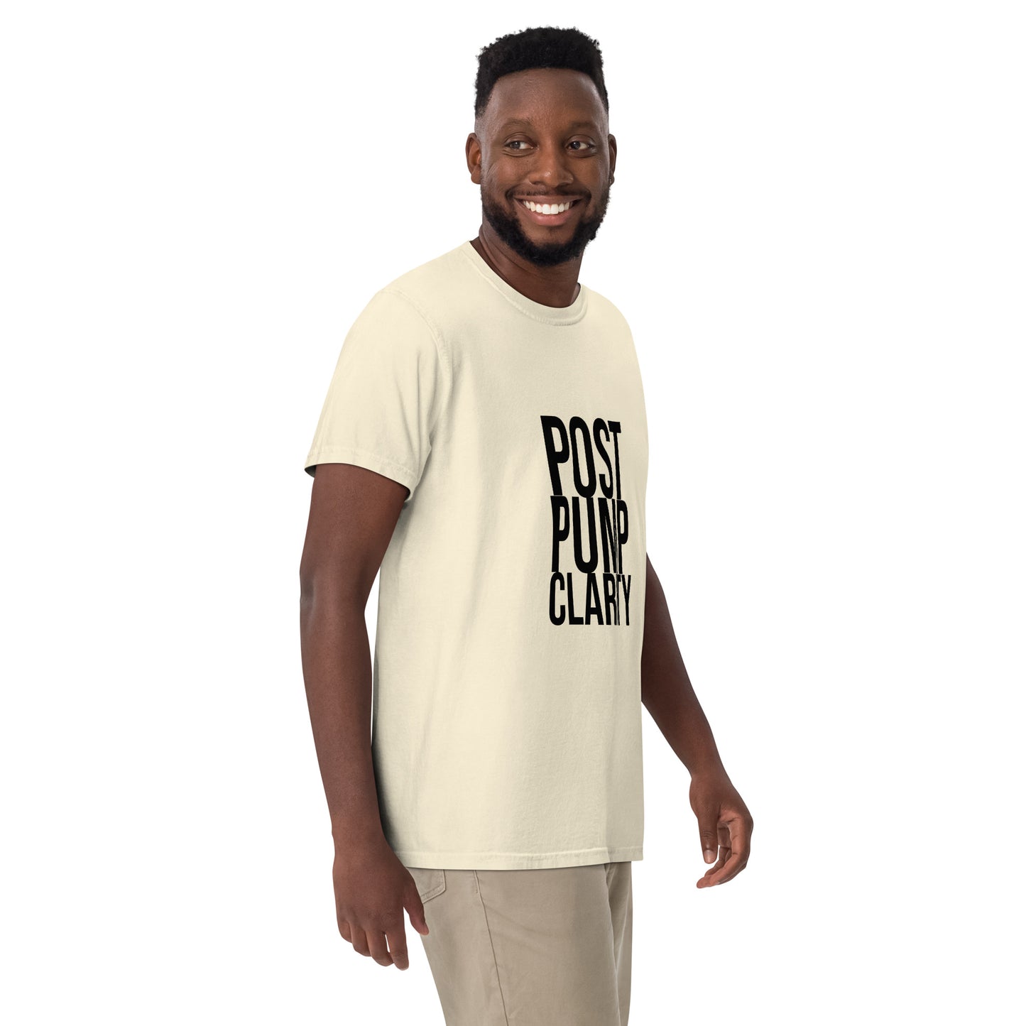 A person in a Bougie Boiz Clubs green Post Pump Clarity unisex T-shirt stands against a white background, smiling with one arm slightly bent.