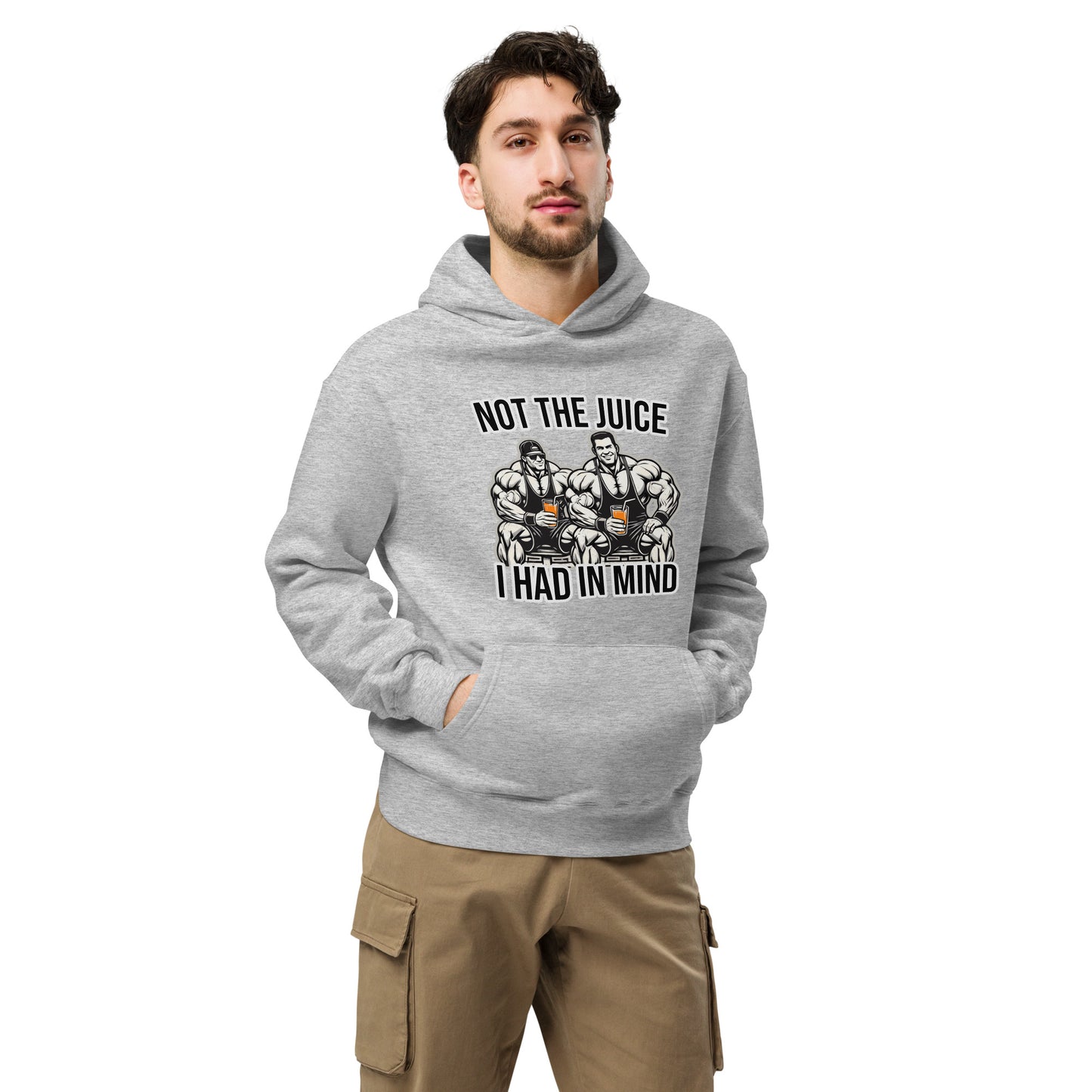 A man wearing Bougie Boiz Clubs Not The Juice - Unisex Oversized Hoodie, featuring two knights with goblets and gym humor text, complements khaki cargo pants. This relaxed fit stands out against a plain white background.