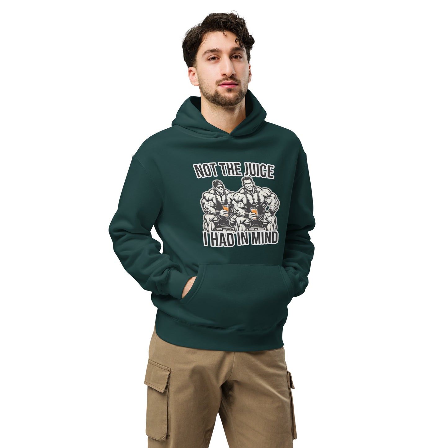 A man wearing Bougie Boiz Clubs Not The Juice - Unisex Oversized Hoodie, featuring two knights with goblets and gym humor text, complements khaki cargo pants. This relaxed fit stands out against a plain white background.