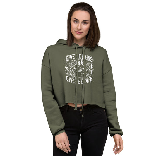 A person exudes a bold look wearing the Bougie Boiz Clubs green Give Me Gains womens crop hoodie with Give me lions or give me death inscribed, perfect for the gym. With shoulder-length brown hair and black pants, they confidently make a striking style statement.